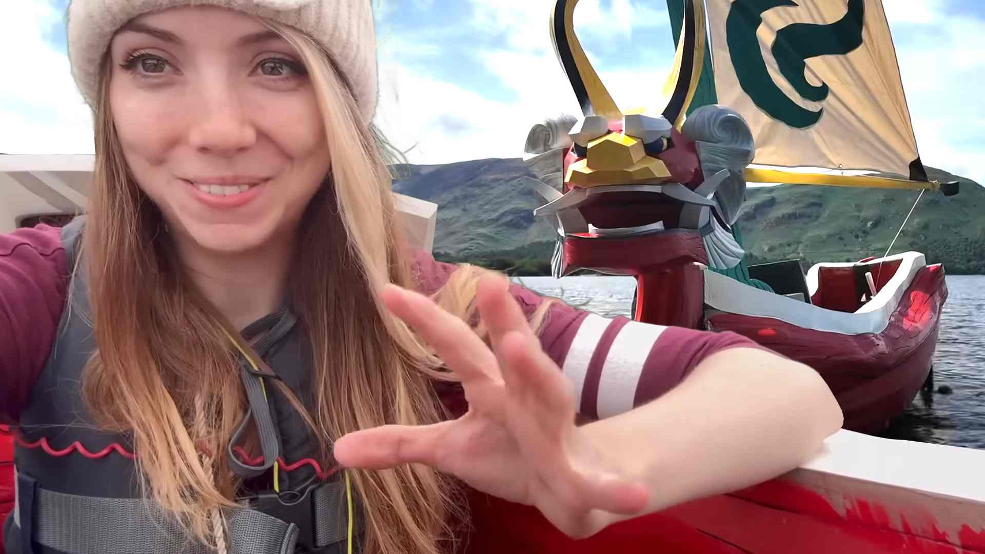 YouTuber LittleJem in front of a real life The Legend of Zelda: Wind Waker King of Red Lions boat