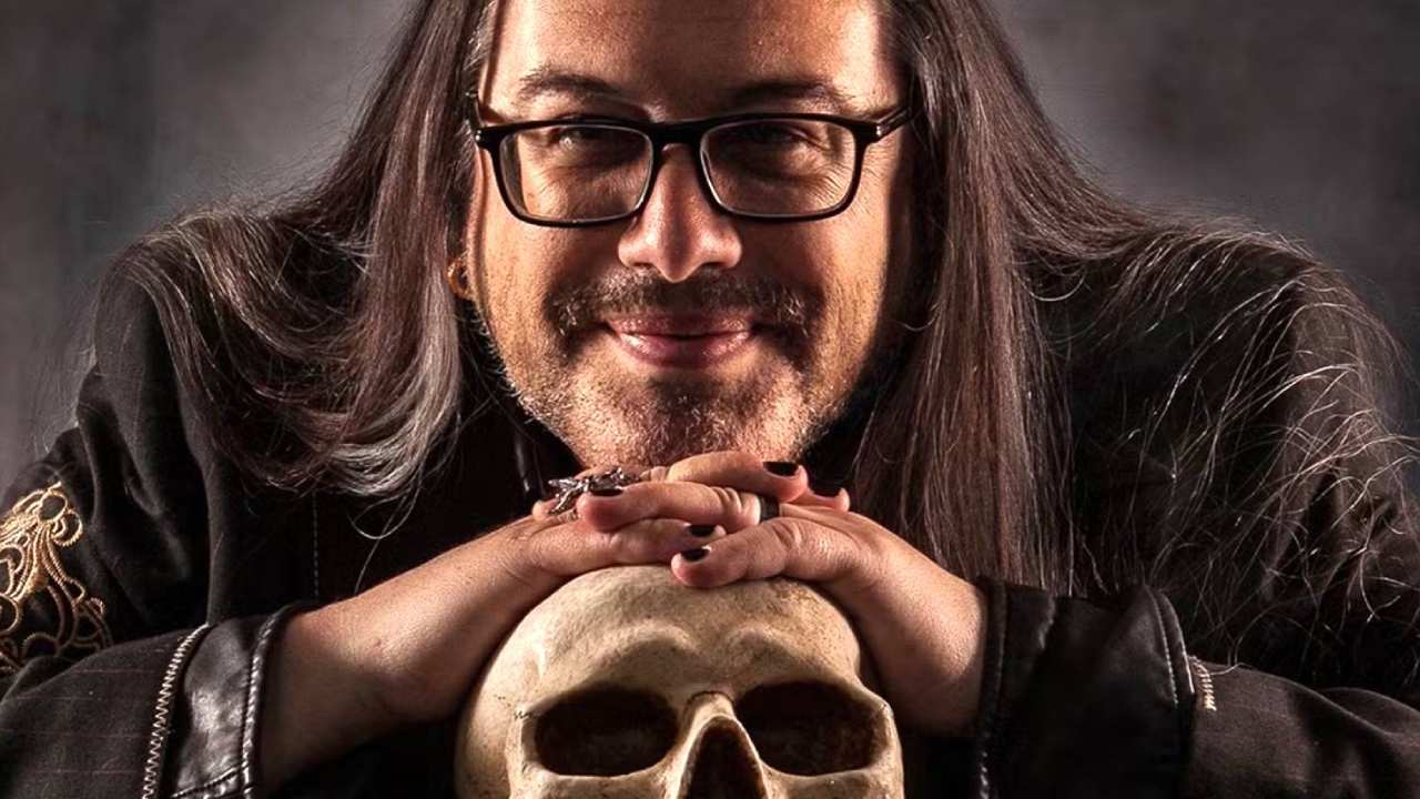 doom co-creator john romero resting on a skull