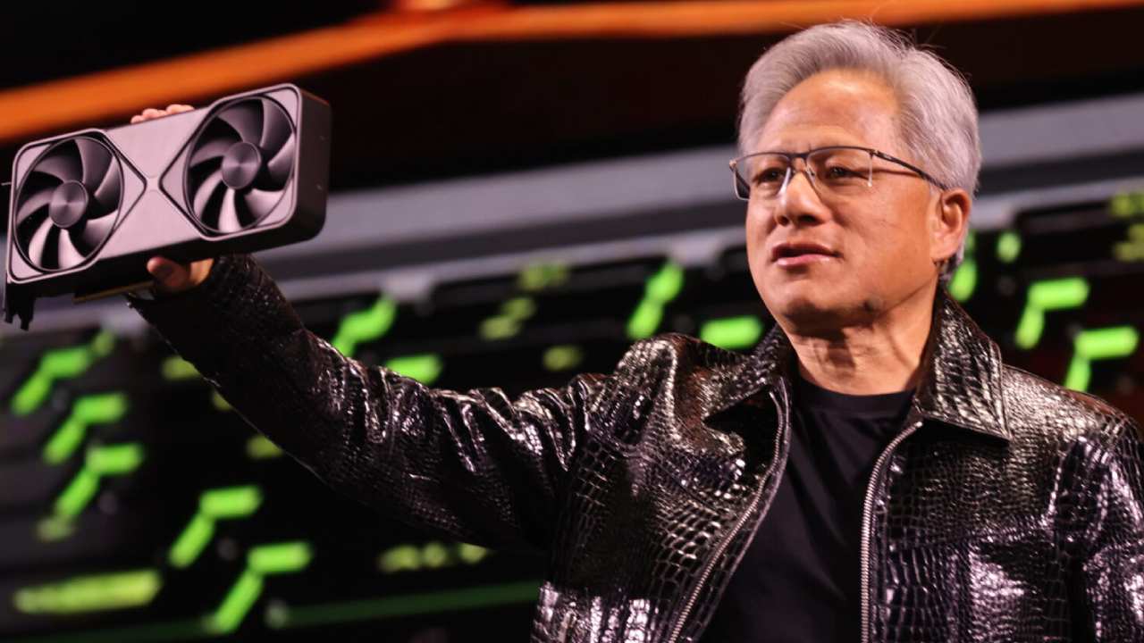 Nvidia CEO Jensen holding a GPU