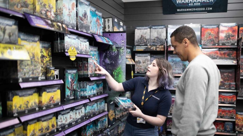 Warhammer store image of an employee serving a customer 
