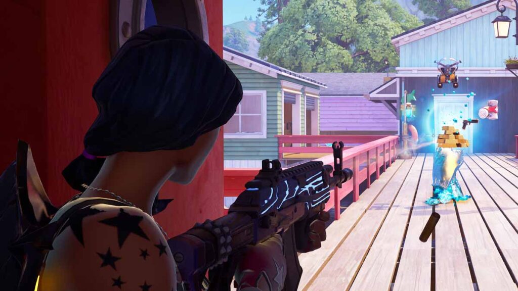 Fortnite player eliminating an enemy with an assault rifle