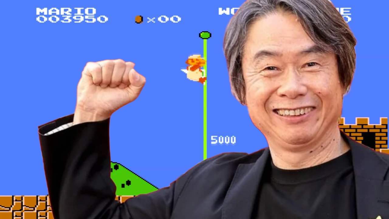 Nintendo icon Shigeru Miyamoto posing in front of Mario 1-1